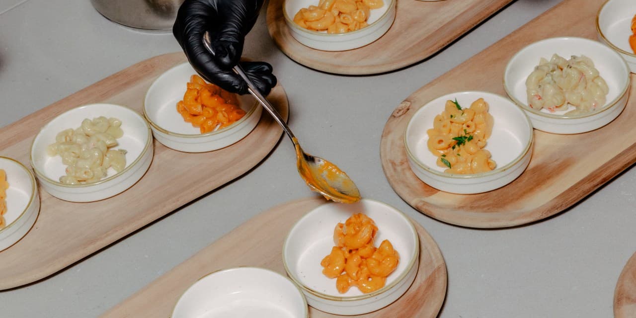 Conagra chefs prepare bowls of mac and cheese for tasting.