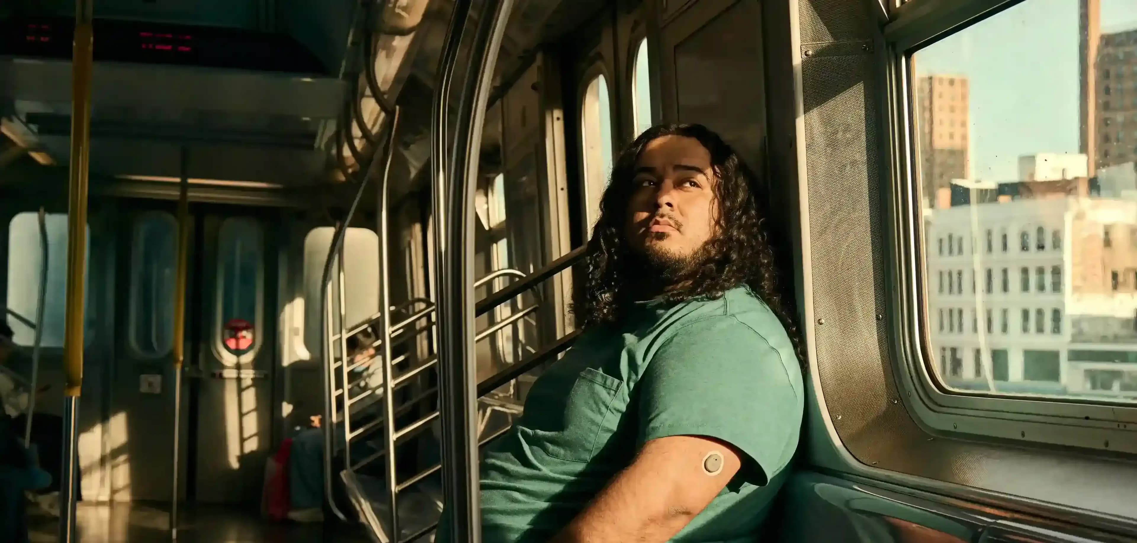 Person seated in transit, used for coverage of appetite, behavior, and GLP-1 clinical research.